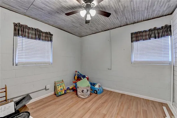 a view of room with toys and wooden floor