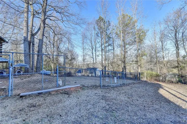 a backyard of a house with lots of green space
