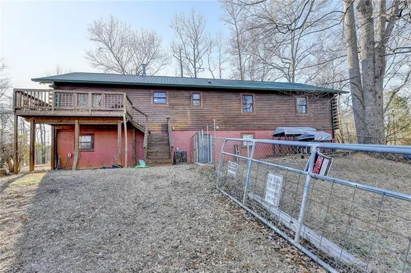 a front view of house with wooden fence