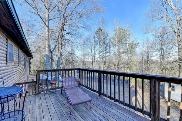 a view of balcony with wooden floor and fence and floor