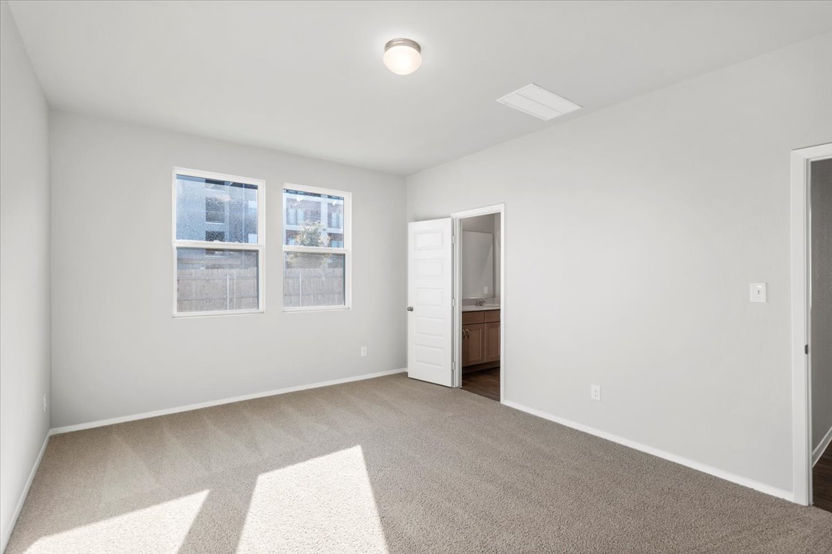 2711 Totley Road Manor, TX 78653 - Photo 21 of 40 an empty room with windows