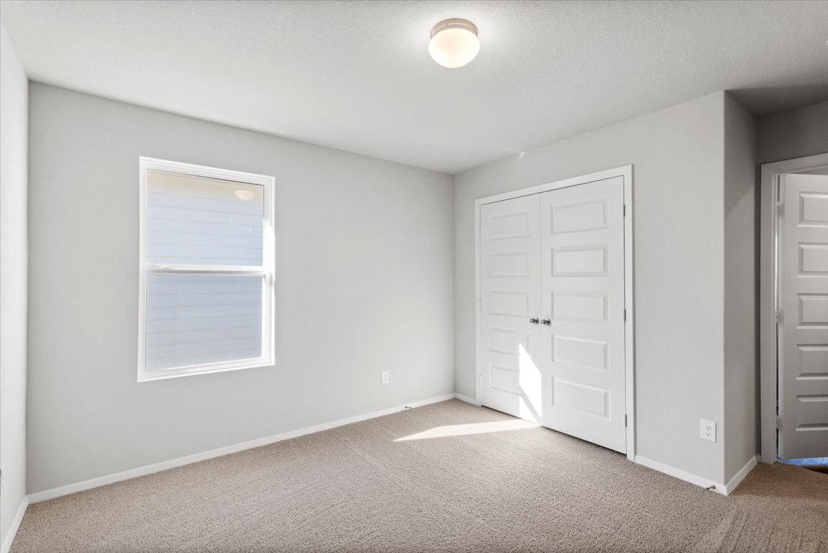 2711 Totley Road Manor, TX 78653 - Photo 32 of 40 an empty room with a empty space and windows