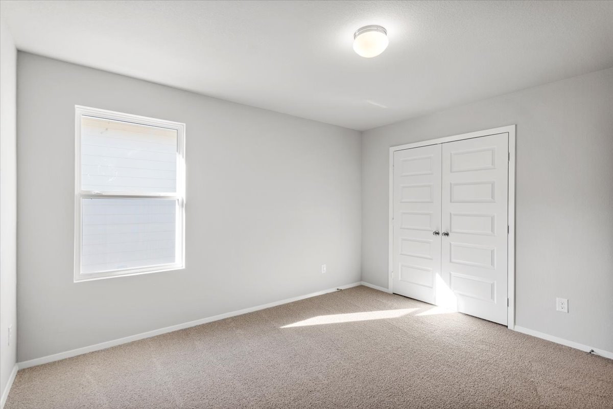 2711 Totley Road Manor, TX 78653 - Photo 38 of 40 an empty room with windows and closet