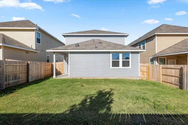 a view of a backyard of the house