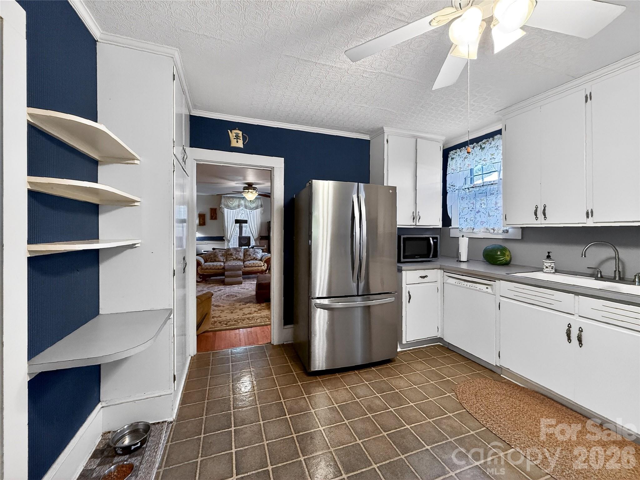 192 West Court Street Rutherfordton, NC 28139 - Photo 17 of 36 a kitchen with a refrigerator and a sink