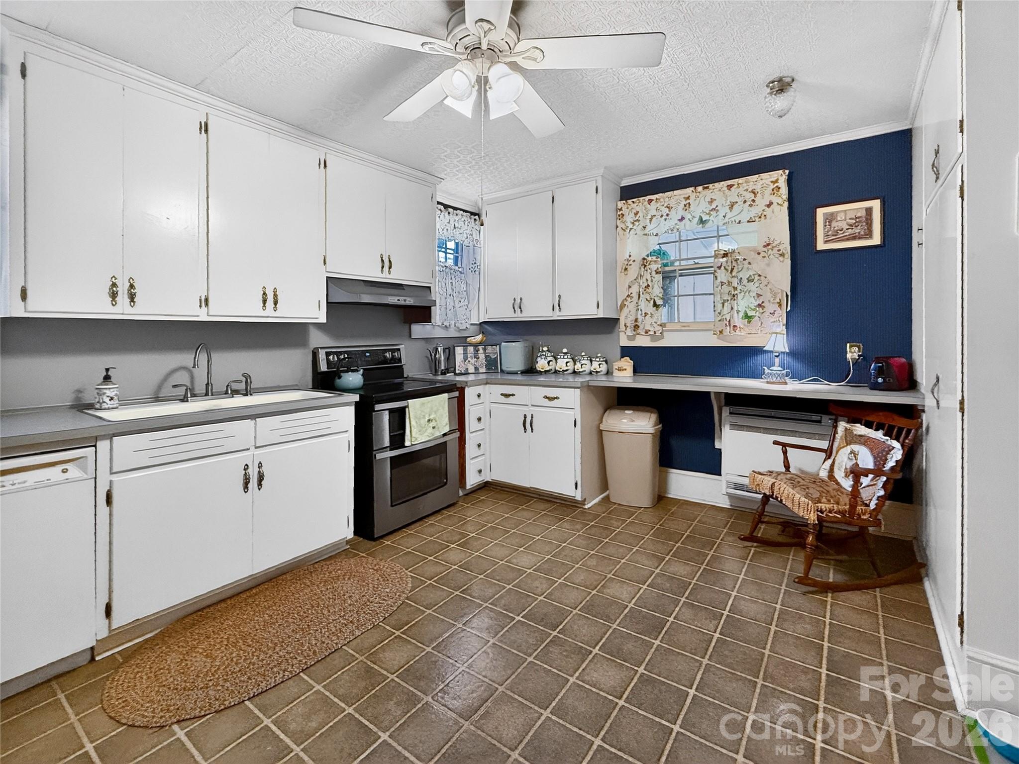 192 West Court Street Rutherfordton, NC 28139 - Photo 31 of 36 a kitchen with a sink cabinets and window