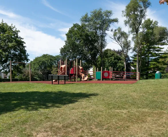 a view of outdoor space with garden and trees