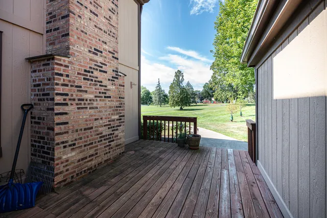 a large kitchen with cabinets wooden floor and a sink