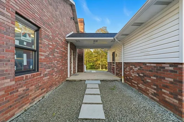 a view of front door and yard