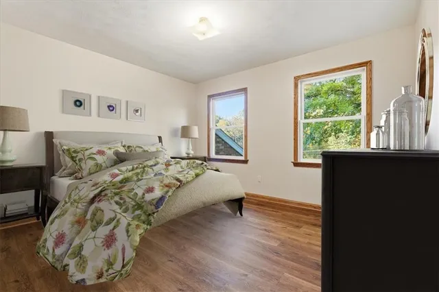 a bed room with a bed and a window