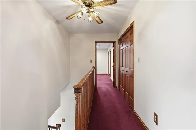 a view of empty room with wooden ceiling