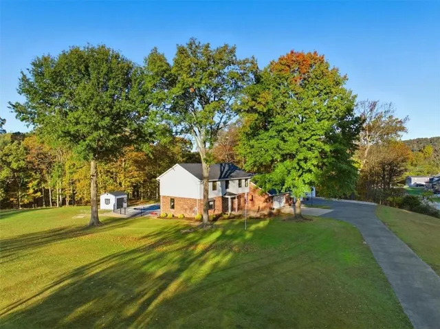 a view of a house with a yard