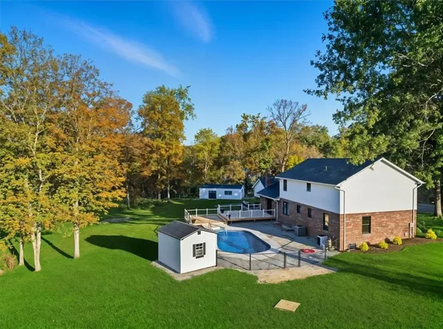 a view of a house with a yard porch and sitting area