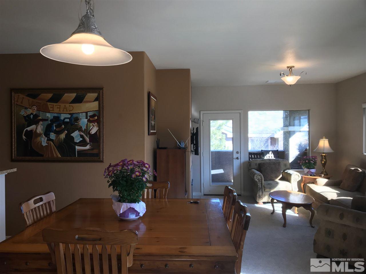 900 South, Unit 2424 Reno, NV 89521 - Photo 2 of 9 a living room with furniture dining table and a chandelier