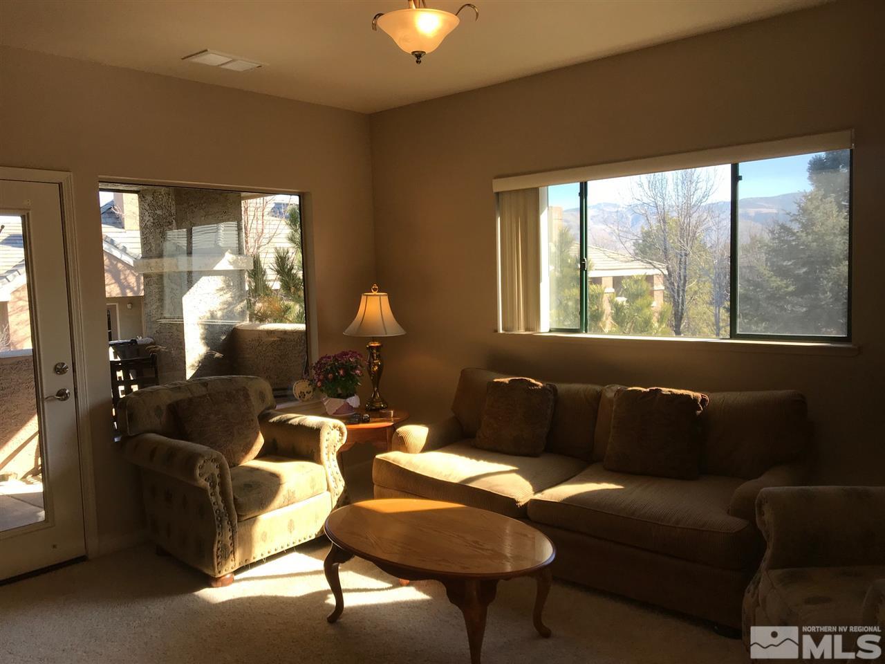 900 South, Unit 2424 Reno, NV 89521 - Photo 4 of 9 a living room with furniture and a lamp
