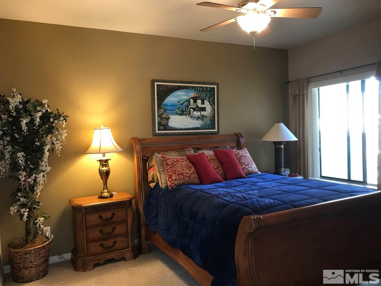900 South, Unit 2424 Reno, NV 89521 - Photo 6 of 9 a bedroom with a bed and a window