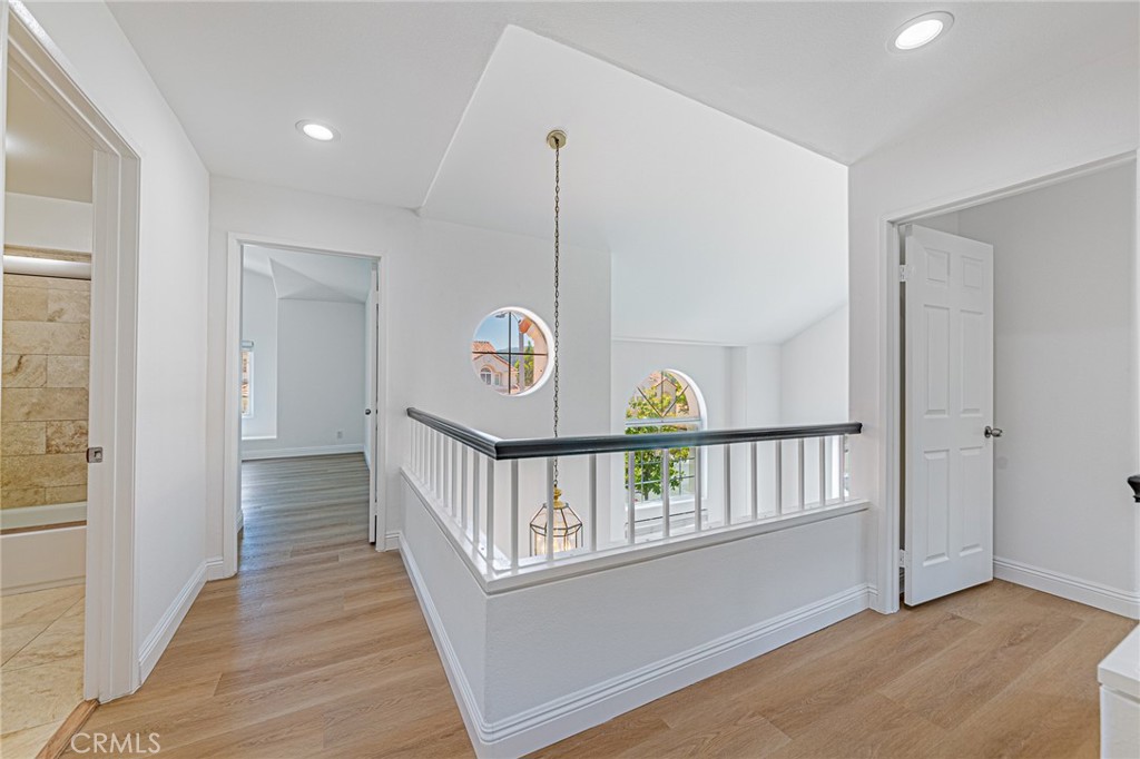 25533 Longfellow Place Stevenson Ranch, CA 91381 - Photo 18 of 47 a view of an entryway with wooden floor
