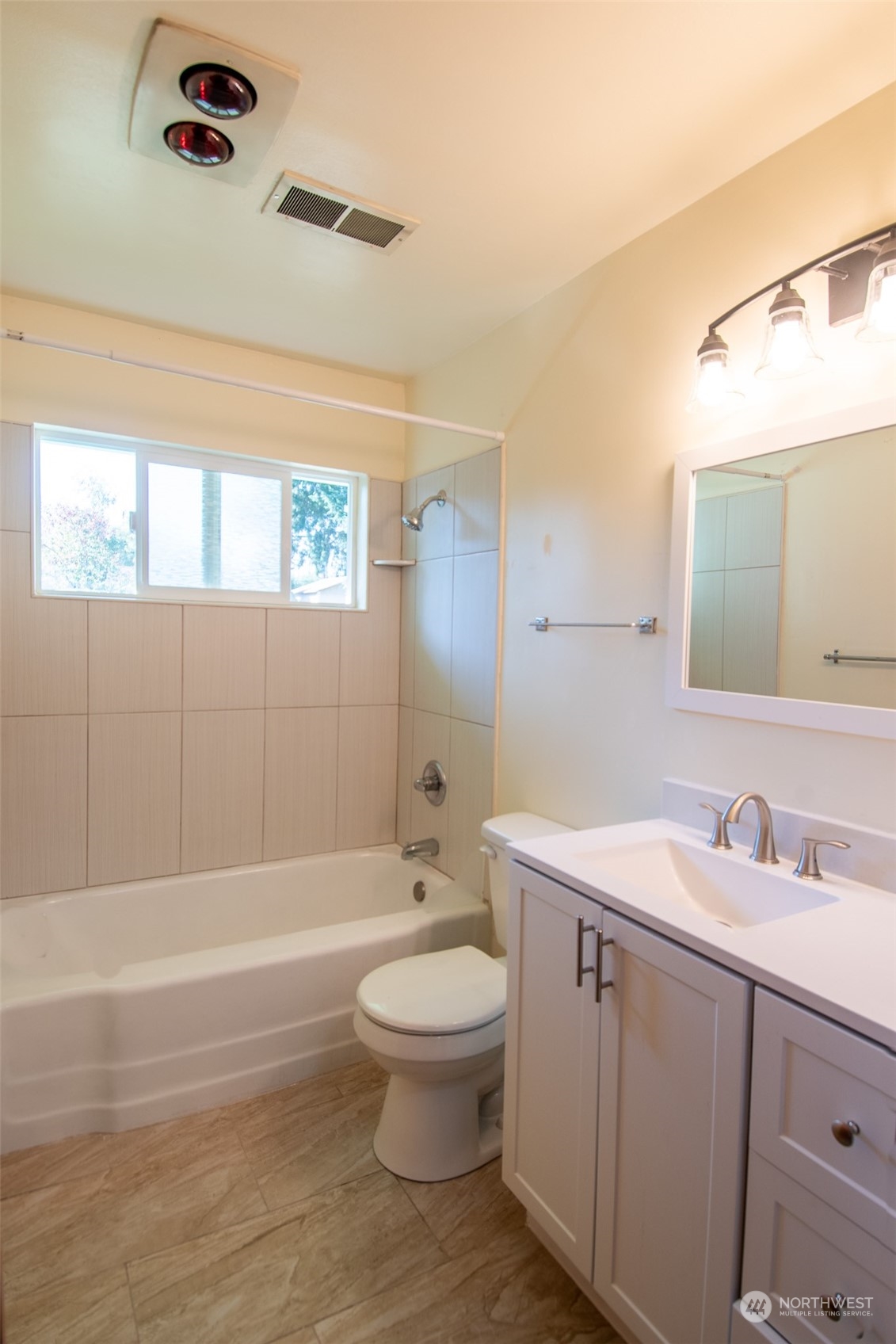 17039 123rd Avenue Southeast Renton, WA 98058 - Photo 5 of 11 a bathroom with a toilet a sink and a bathtub