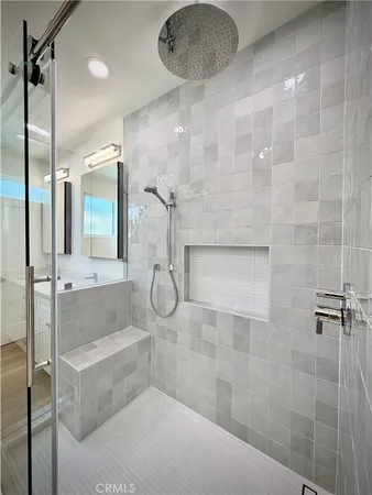 a bathroom with a bathtub toilet sink vanity and windows