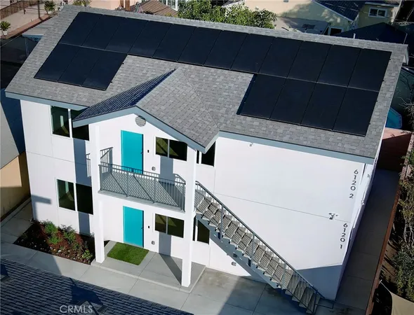 an aerial view of a house with balcony