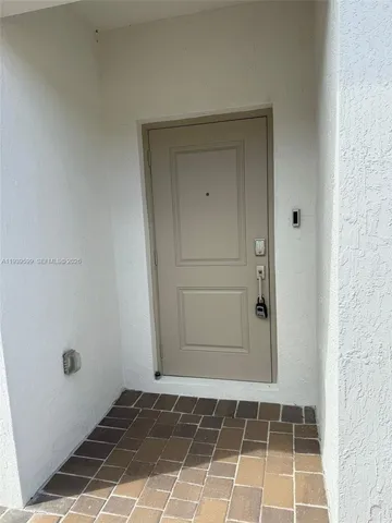 an empty room with a wooden door