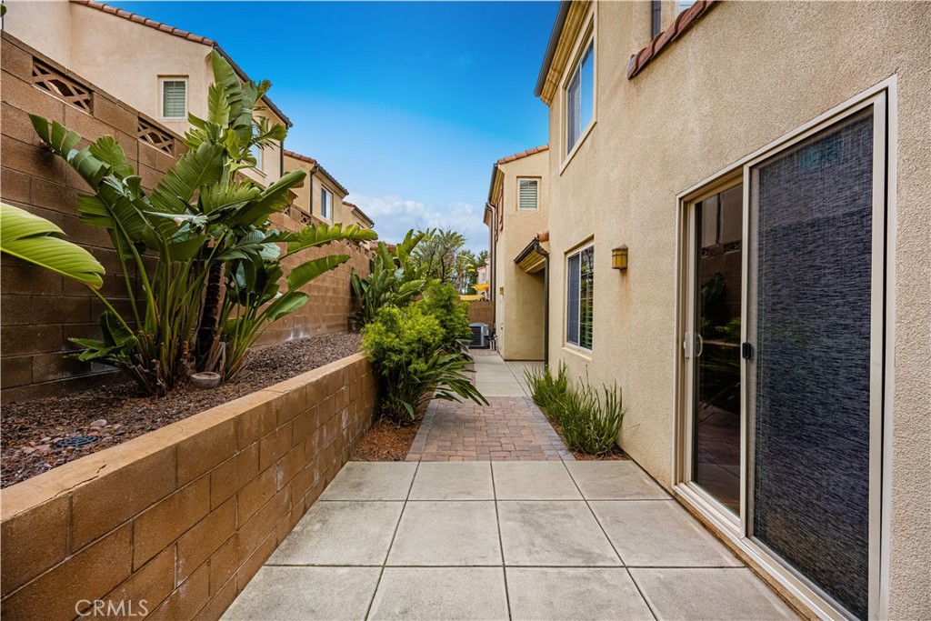 56 Pathway Irvine, CA 92618 - Photo 16 of 52 a entryway with flower garden