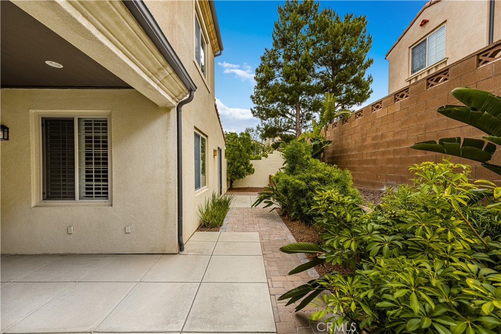 56 Pathway Irvine, CA 92618 - Photo 20 of 52 a entryway view with a garden