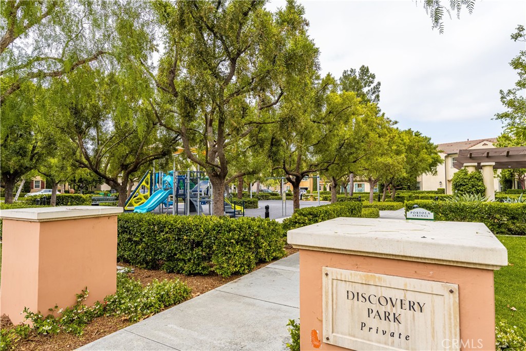 56 Pathway Irvine, CA 92618 - Photo 46 of 52 a view of a street with a building and trees in the background