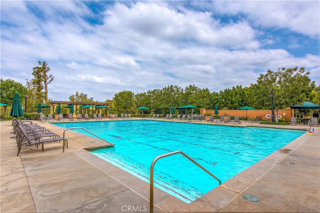 56 Pathway Irvine, CA 92618 - Photo 47 of 52 a view of a swimming pool with a lounge chairs