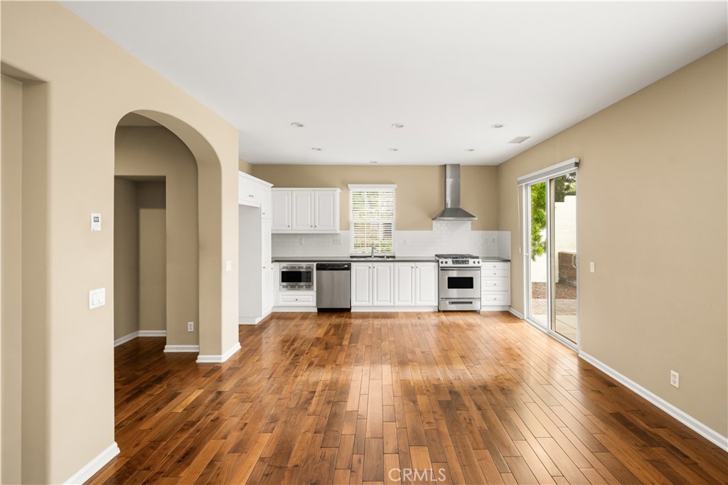56 Pathway Irvine, CA 92618 - Photo 7 of 52 a view of kitchen with wooden floor and electronic appliances