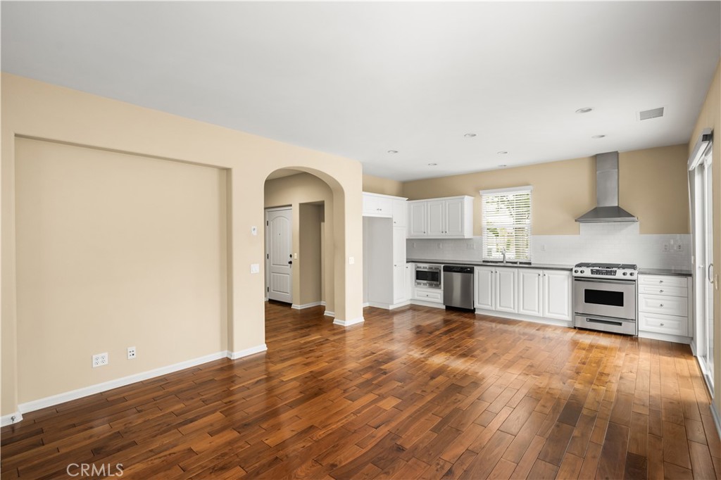 56 Pathway Irvine, CA 92618 - Photo 8 of 52 a view of a kitchen with a sink stove cabinets and empty room