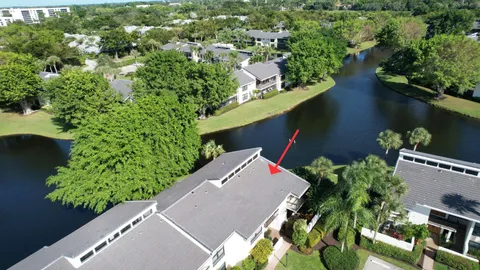 an aerial view of house with yard swimming pool and outdoor seating