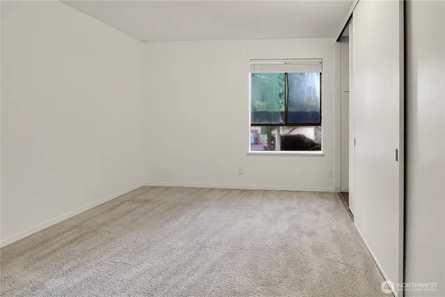 an empty room with a mirror