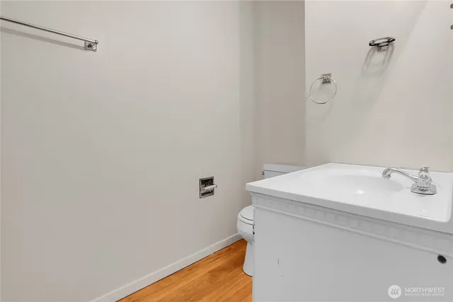 a bathroom with a sink and vanity