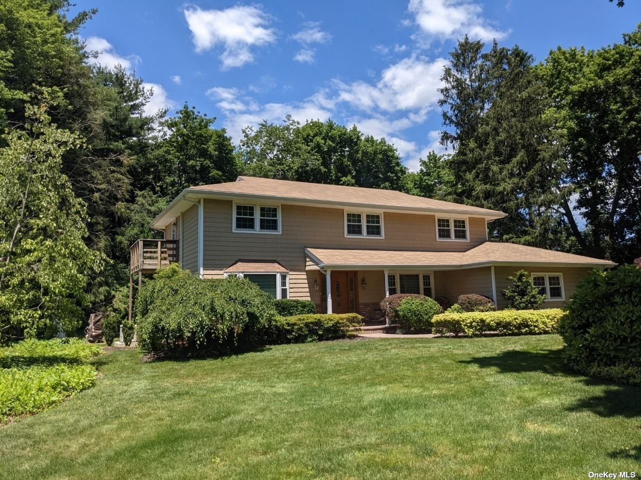 2 South Lot Road, Unit RD Smithtown, NY 11787 - Photo 1 of 1 a view of a house with a yard table and chairs