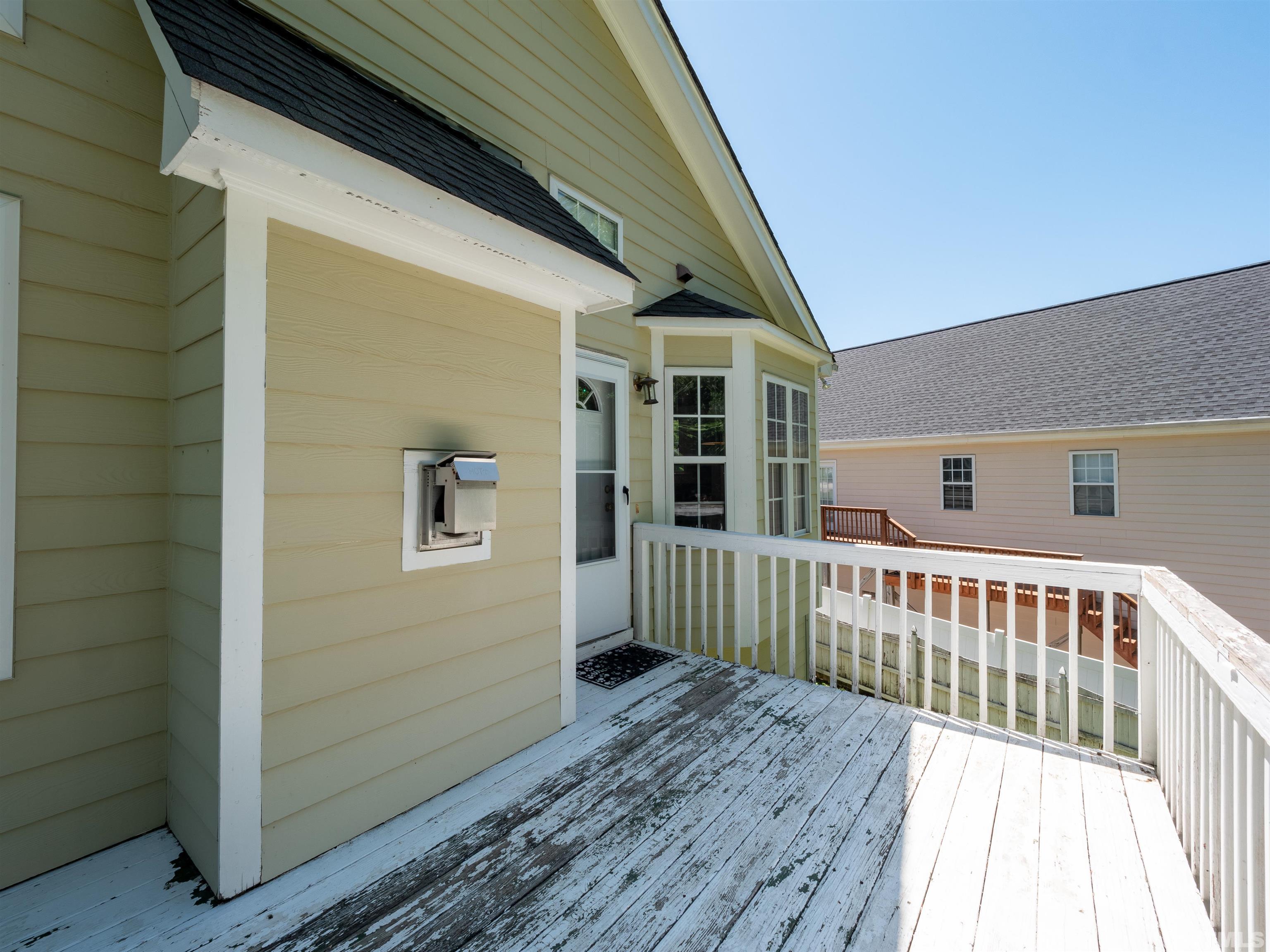 818 Shackleton Road Apex, NC 27502 - Photo 12 of 20 a view of a house with wooden deck