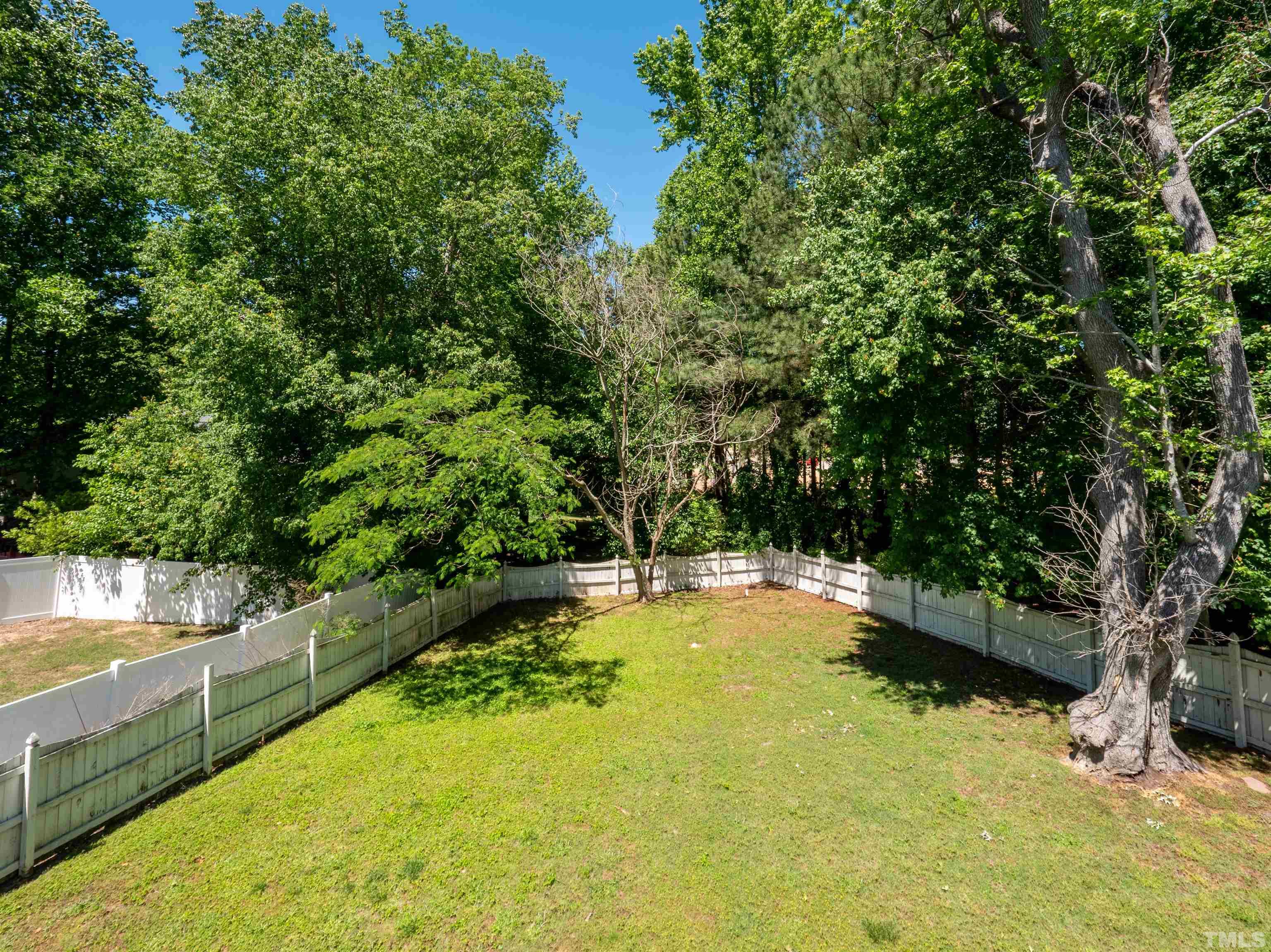 818 Shackleton Road Apex, NC 27502 - Photo 13 of 20 a swimming pool with some trees