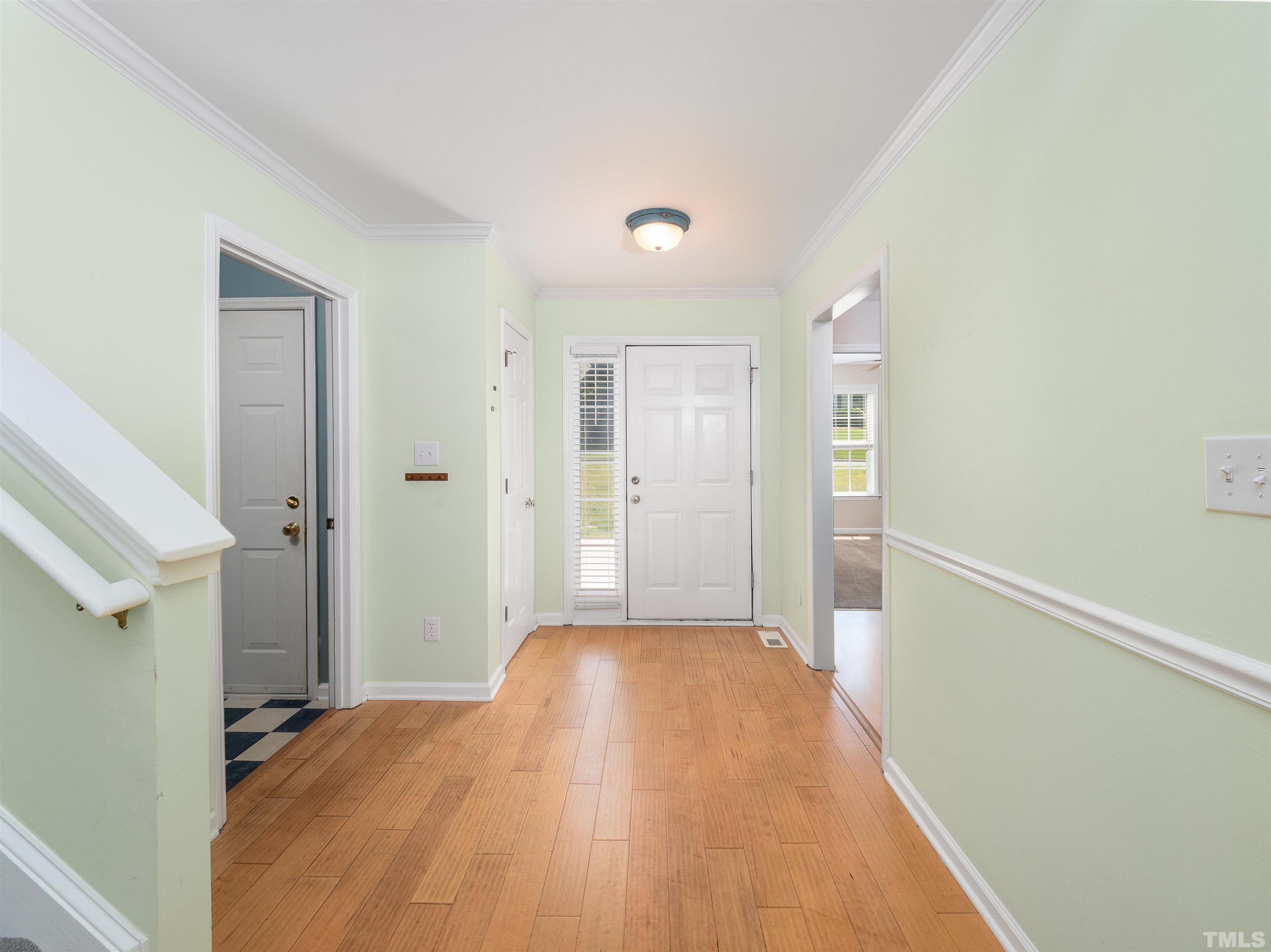 818 Shackleton Road Apex, NC 27502 - Photo 2 of 20 a view of hallway with wooden floor