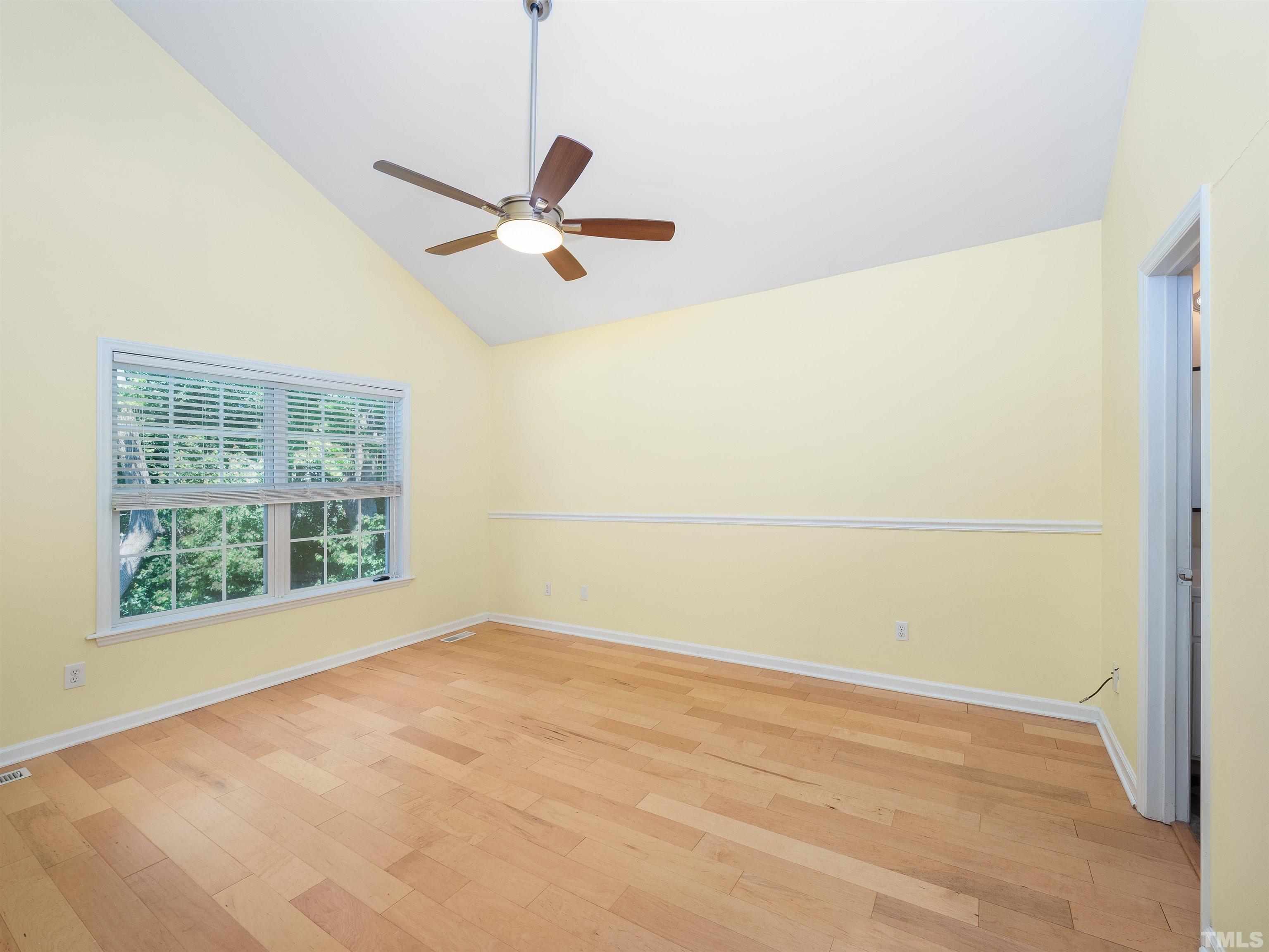 818 Shackleton Road Apex, NC 27502 - Photo 7 of 20 a view of an empty room with a window
