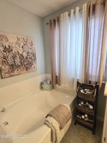 a livingroom with workspace and a window