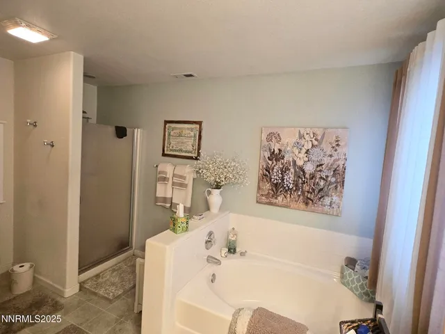 a bathroom with a toilet a sink and shower