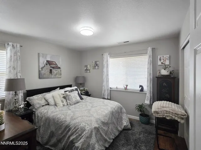 a view of a house with wooden fence