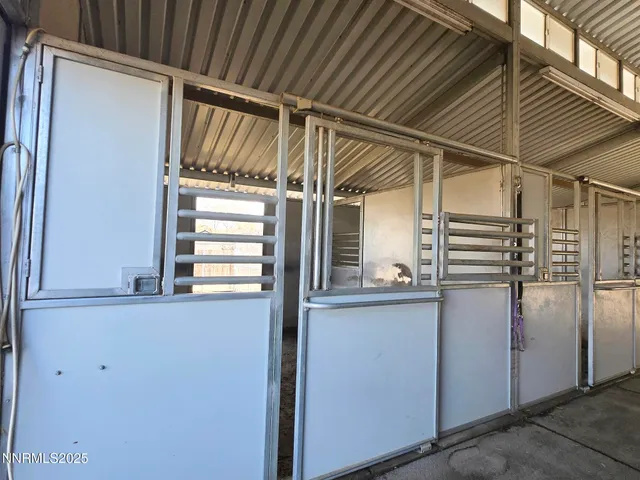 a view of a patio with table and chairs
