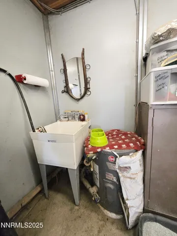 a view of a backyard with wooden fence