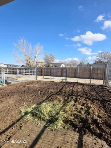 a view of a backyard with sitting area