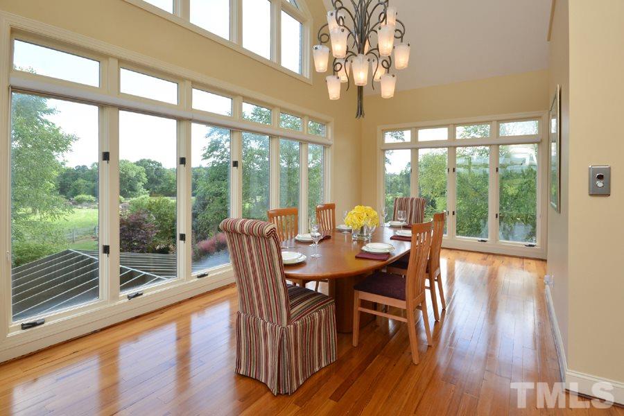 7016 Holly Ridge Road Rougemont, NC 27572 - Photo 11 of 24 This light filled gathering area boasts a butler's pantry and high cathedral ceilings. The wood-panelled elevator is accessed near the room's arched entrance.