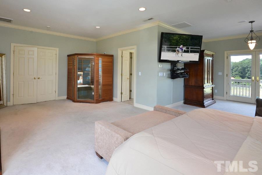7016 Holly Ridge Road Rougemont, NC 27572 - Photo 13 of 24 A two-person sauna sits next to the master bathroom.