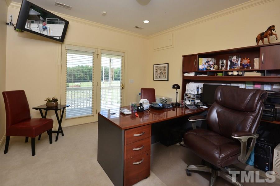 7016 Holly Ridge Road Rougemont, NC 27572 - Photo 20 of 24 Also has French doors open to the rear porch and a deep double-doored closet with built-ins.