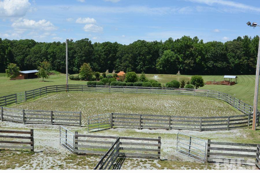 7016 Holly Ridge Road Rougemont, NC 27572 - Photo 5 of 24 The perfect overlook to sit and enjoy the view of the koi pond, pastures, and lit riding arena activity.