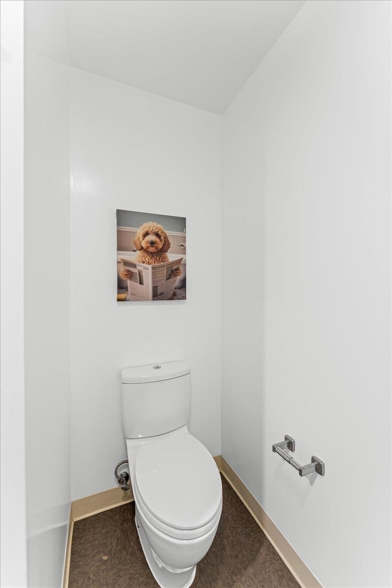 1201 Pine Street, Unit 365 Oakland, CA 94607 - Photo 18 of 33 a white toilet sitting next to a white wall